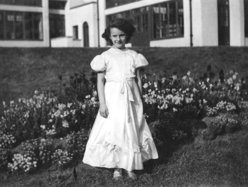 A little girl dressed as a flower girl for a fancy dress party at Stannington Sanatorium, 1948.