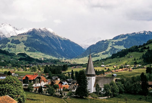 View from Schonriedstrasse of Eglise de Saanen, Gstaad, Bernese Oberland, late 1950s