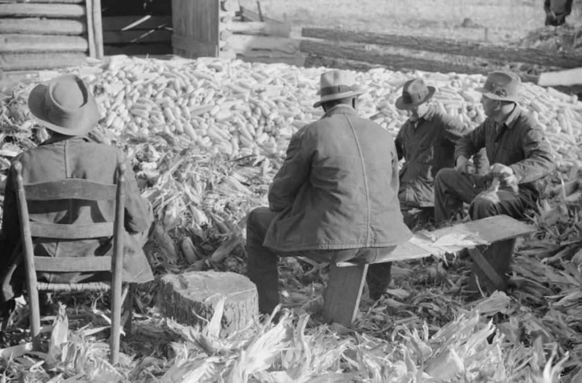 Corn shucking on Uncle Henry Garrett’s place, Tally Ho, near Stem, Granville County, North Carolina, 1939.