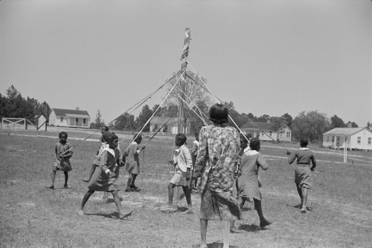 Children dancing around a maypole, Alabama, 1939.