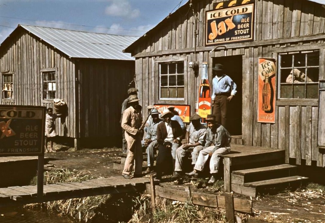 Migratory laborers outside of a ‘juke joint’ during a slack season, Belle Glade, Florida, February 1941.