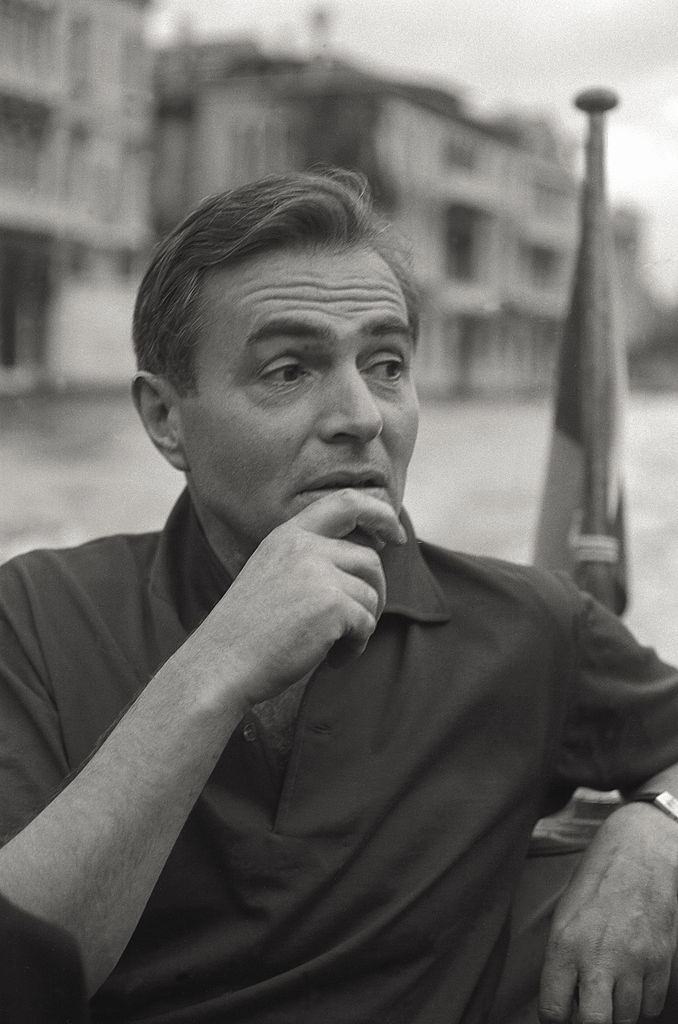 The actor James Mason having a conversation on boat, in the course of the 17th Venice Intenational Film Festival.