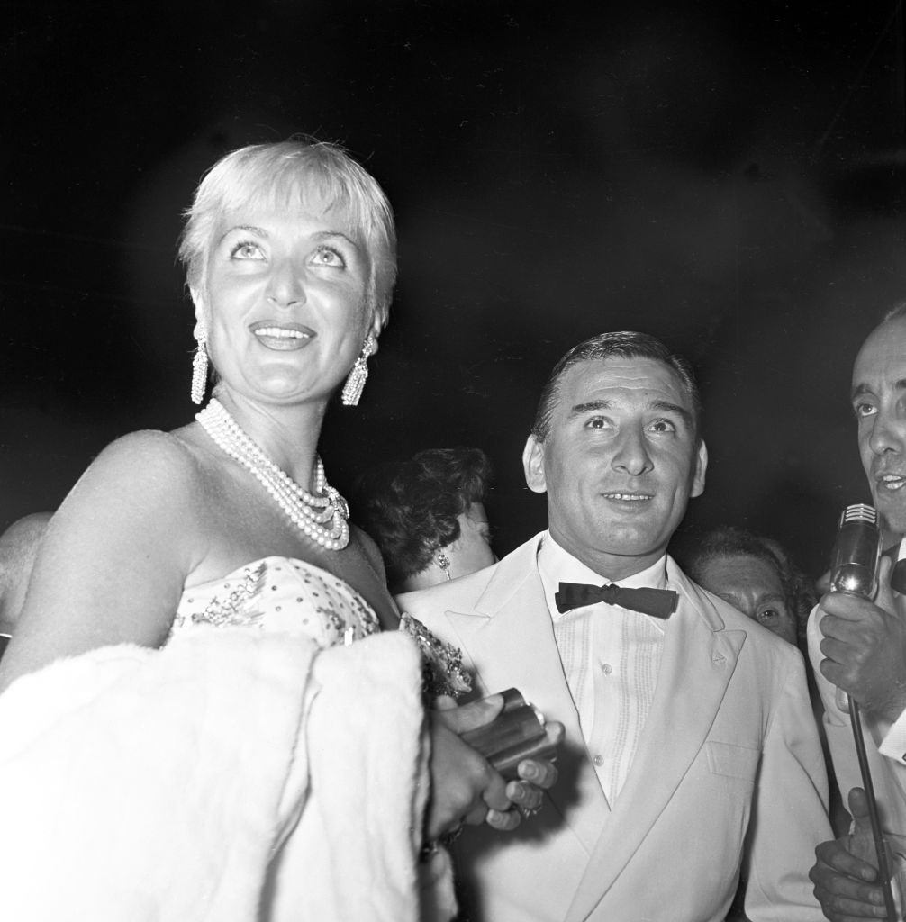 Italian actor Renato Rascel (Renato Ranucci) attending to the Film Festival with Italian showgirl Elena Giusti.