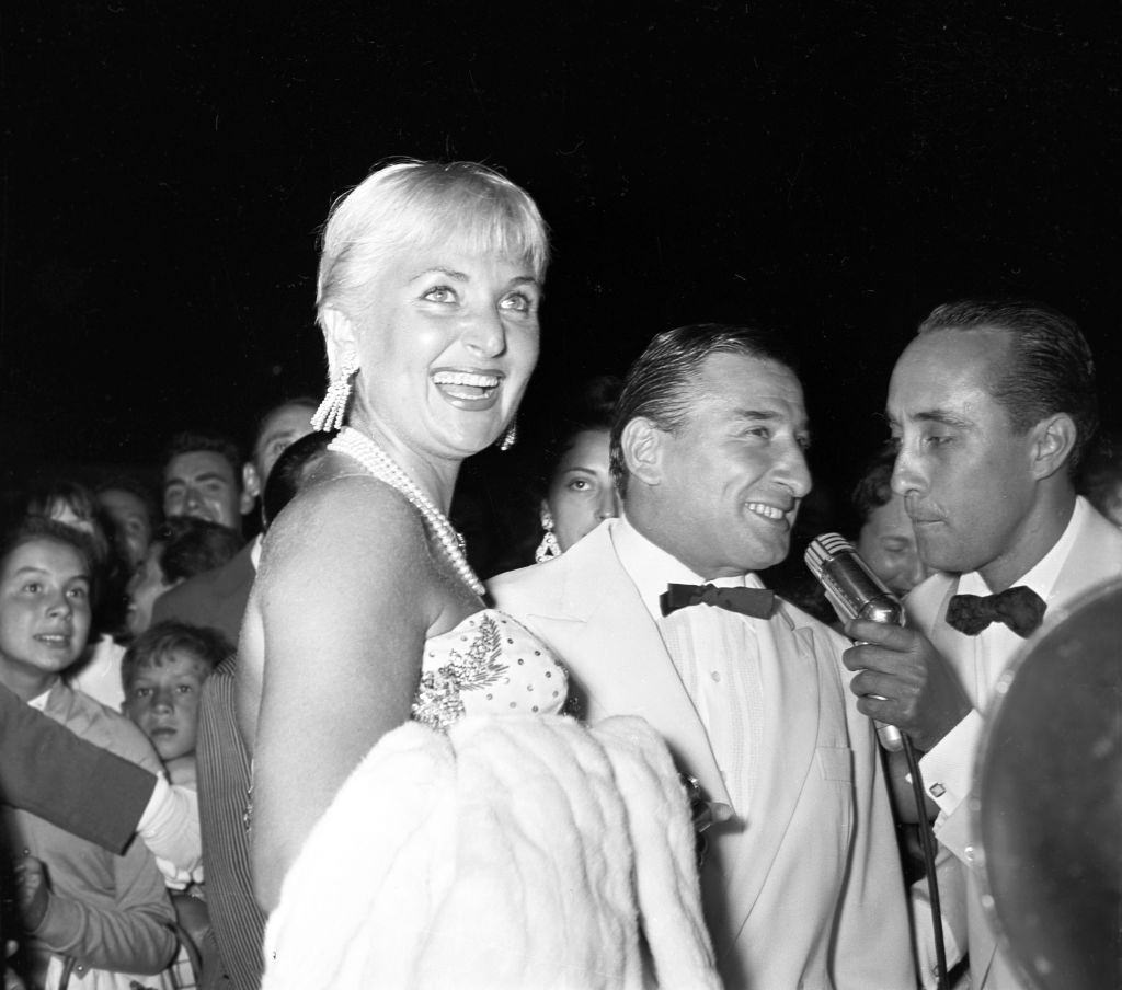 Italian actor Renato Rascel (Renato Ranucci) attending to the Film Festival with Italian showgirl Elena Giusti.