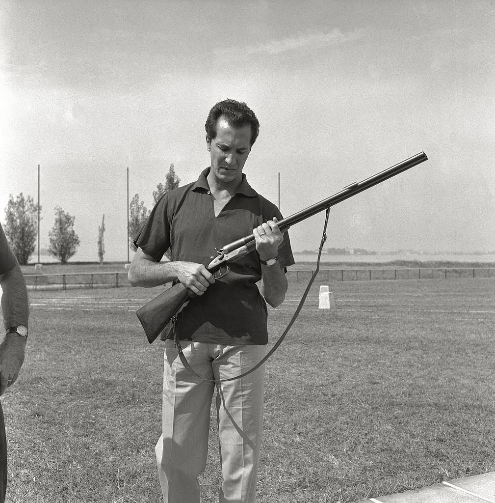 The Spanish bullfighter Luis Miguel Dominguìn, husband of Maria Bosè, prepares to shoot in a rifle range, during the 17th Venice Intenational Film Festival.
