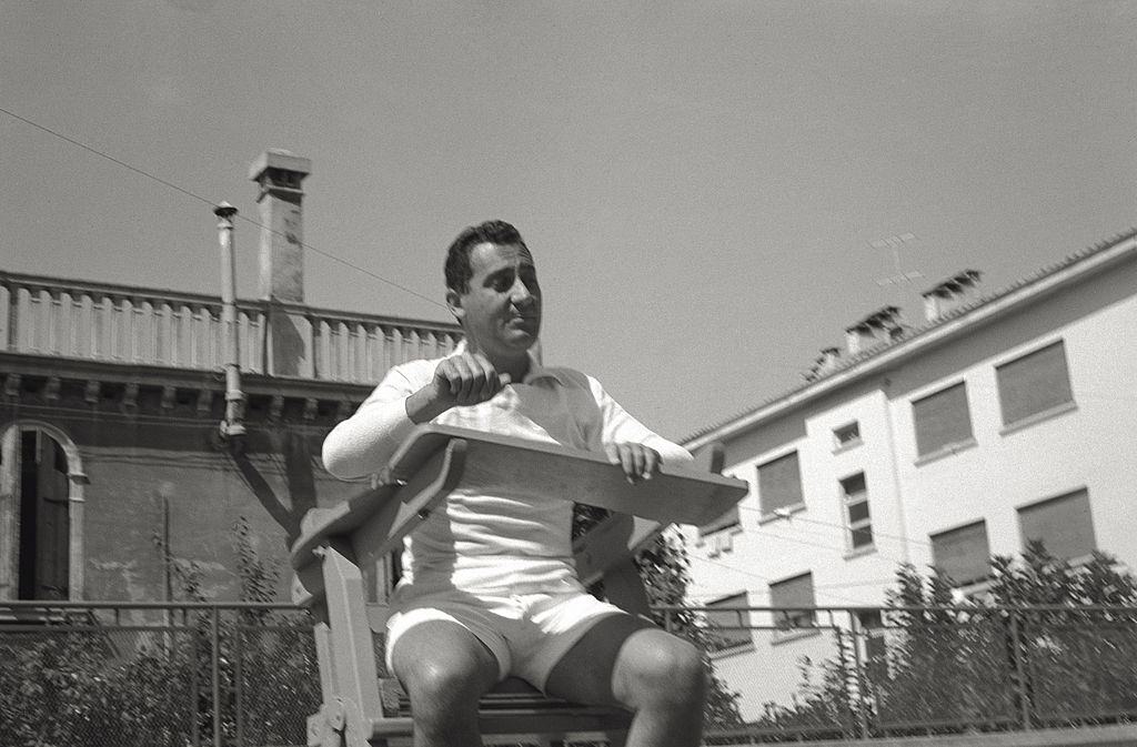 The actor Alberto Sordi makes a pretence of being umpire, sitting on the chair of the competition director, during the 17th Venice Intenational Film Festival.