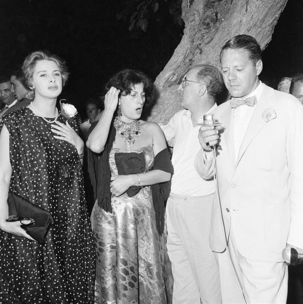 Oscar winning Italian actress Anna Magnani (centre), pictured at her cocktail party, held at the Golf Club Lido di Venezia.