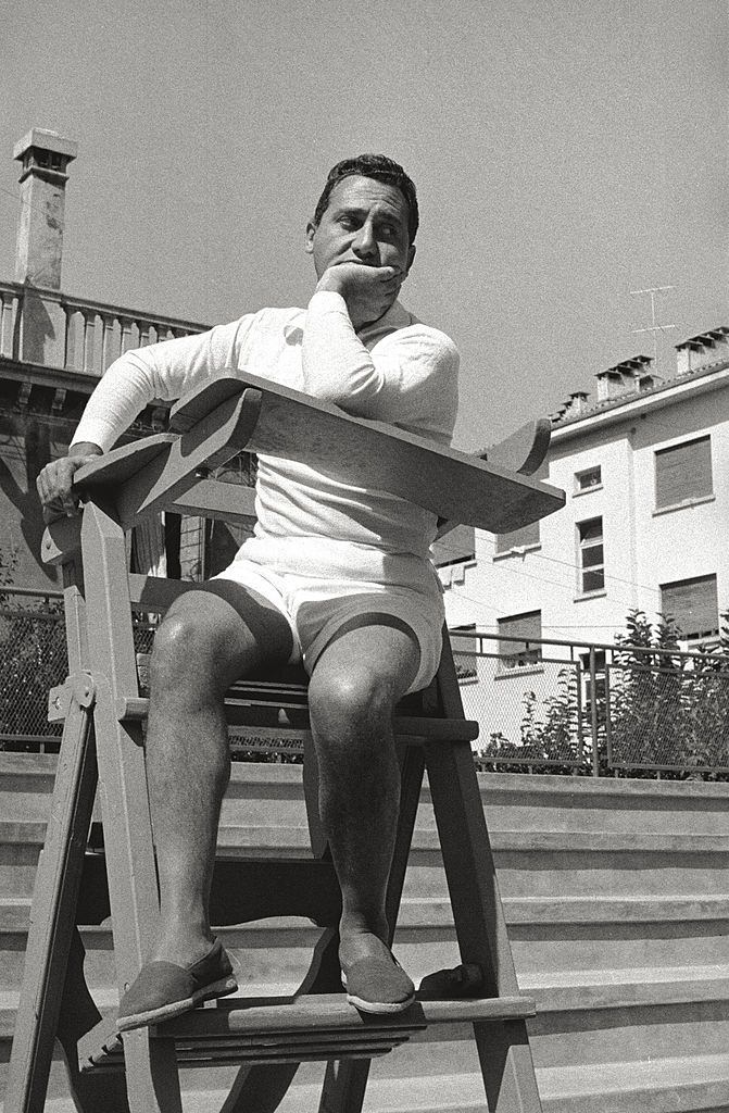 The actor Alberto Sordi makes a pretence of being umpire, sitting on the chair of the competition director, during the 17th Venice Intenational Film Festival.