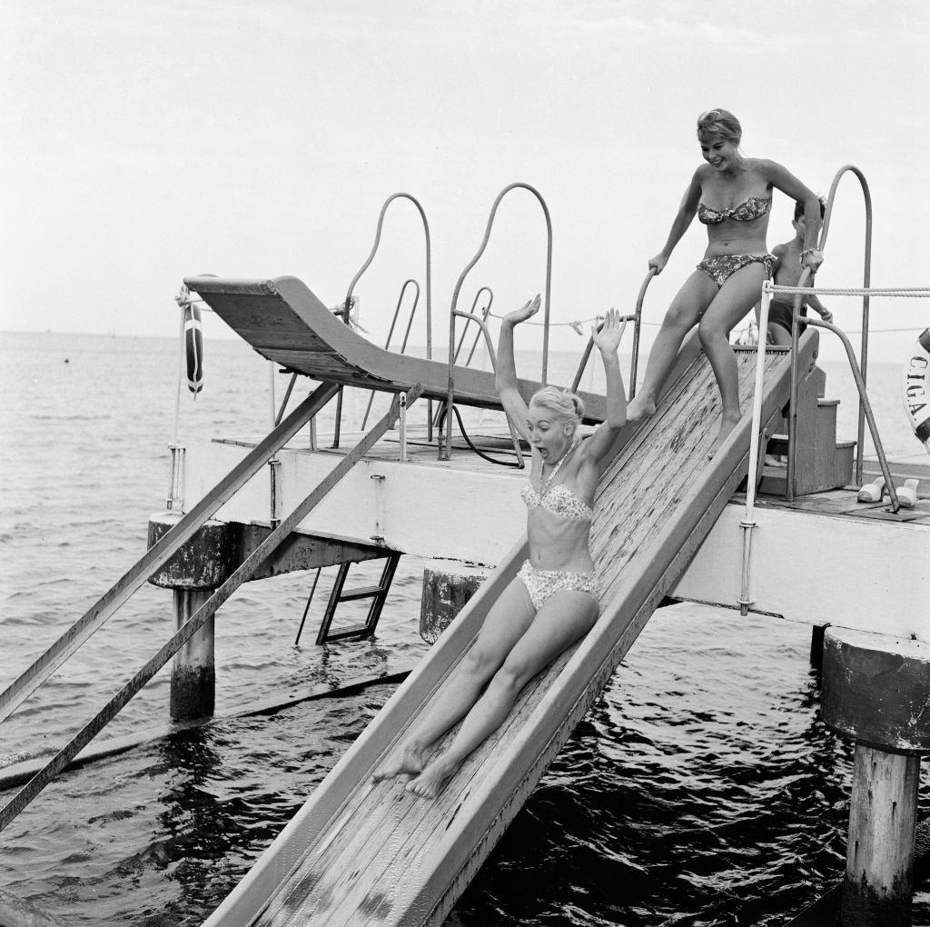 English actress Caryl Gunn gets a push from Italian star Marisa Allasio.