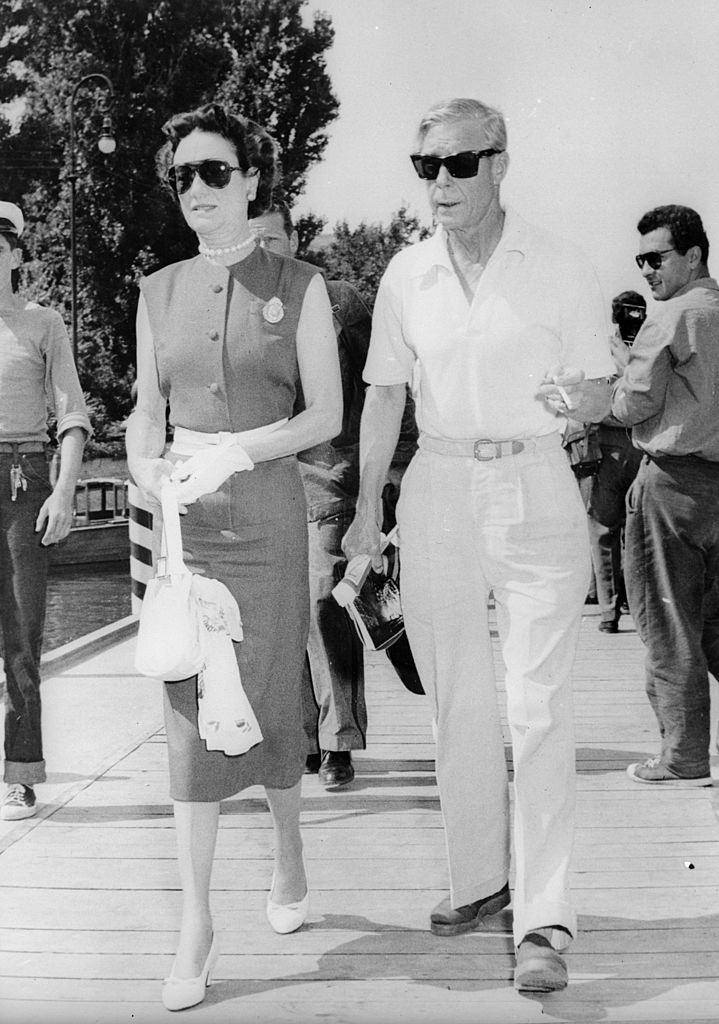 The Duke and Duchess of Windsor take a stroll at the Lido, Venice, where they are attending the International Film Festival, 1956.