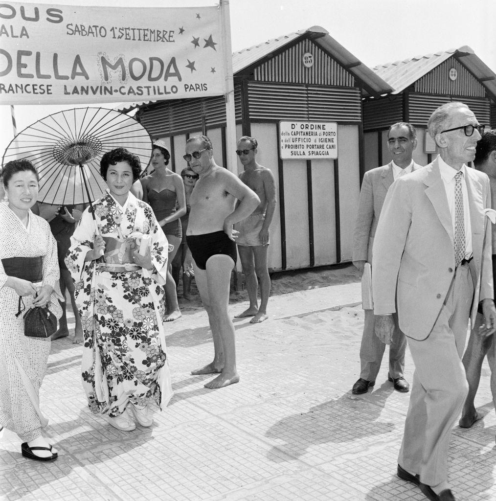 Japanese woman wearing traditional outfit with Parasol at 1956 Venice Film Festival.