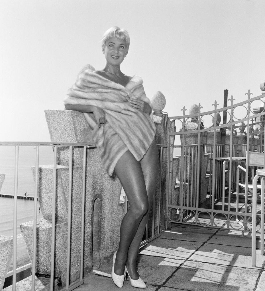 Italian TV star Elena Guisti, wearing a fur wrap at 1956 Venice Film Festival.