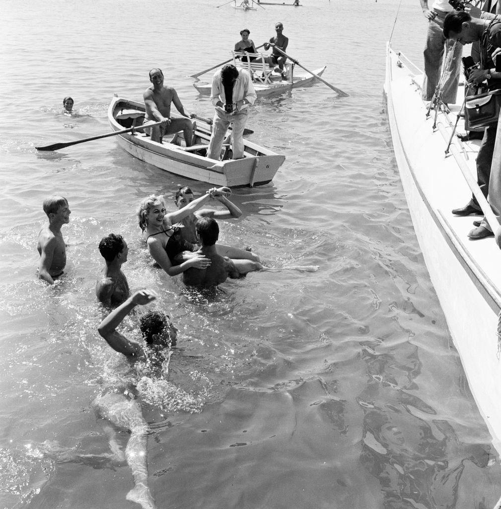 Italian actress Sandra Milo falls into Adriatic, but takes it in good fun at 1956 Venice Film Festival.