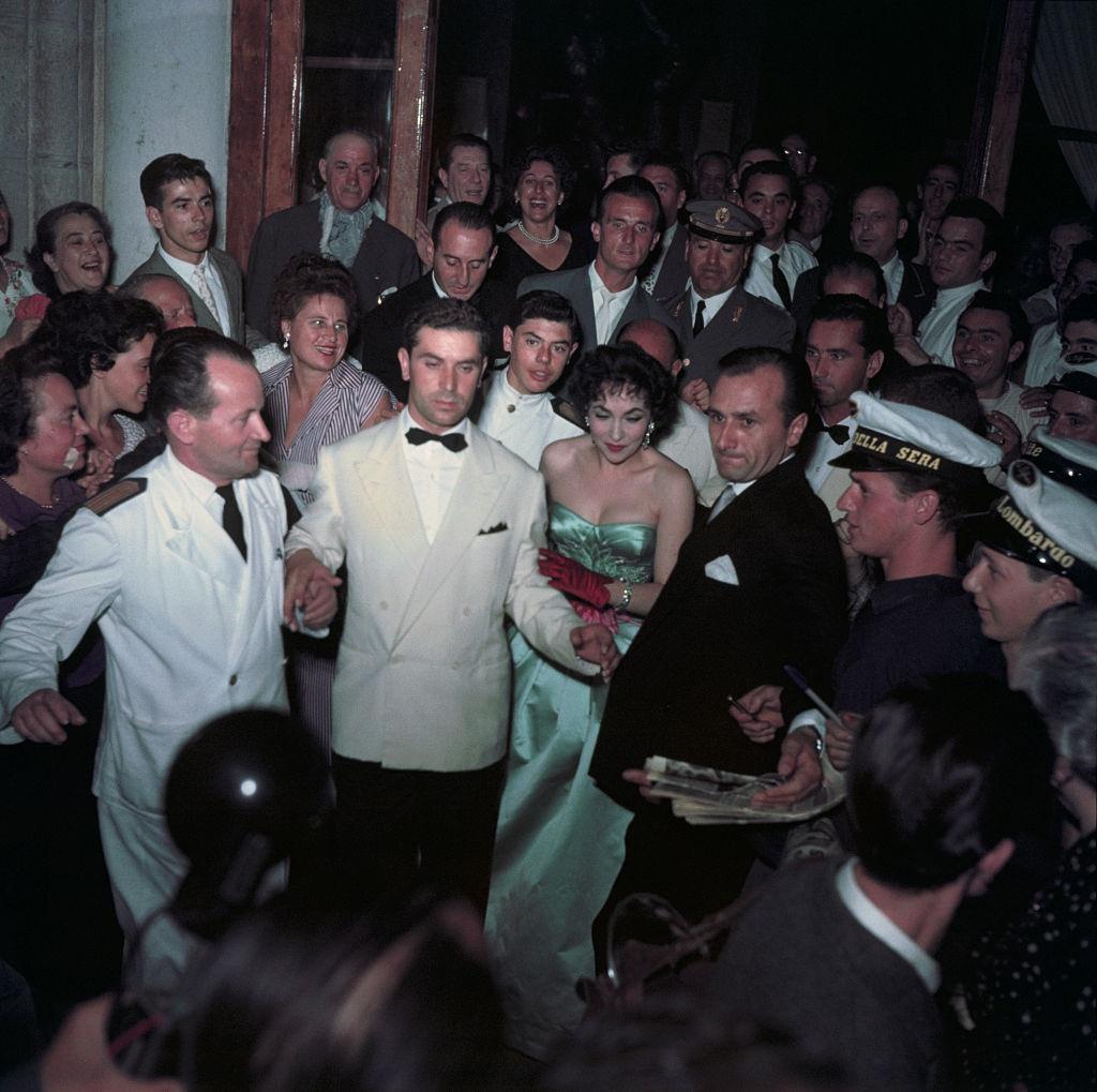 Italian actress Sandra Milo falls into Adriatic, but takes it in good fun at 1956 Venice Film Festival.