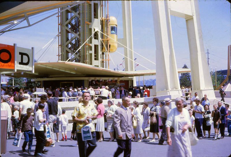 Tourists wander the grounds of the Century 21 Exposition at the 1962 World's Fair in Seattle, Washington