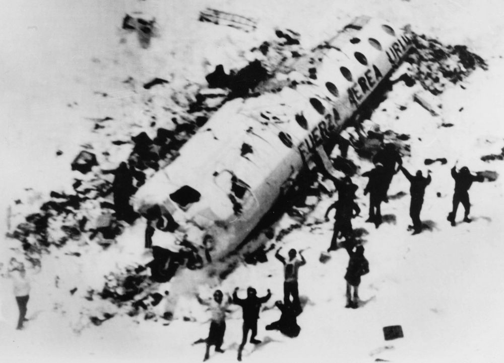 Survivors of Flight 571 outside of the plane's wreckage.