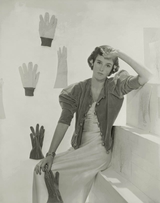 Babe Paley wearing evening dress with shirred bodice, velvet jacket, and matching gloves by Talbot, 1937
