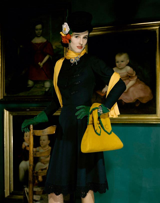 Babe Paley wearing a contrasting wool suit with a yellow bag with green crochet details, 1941