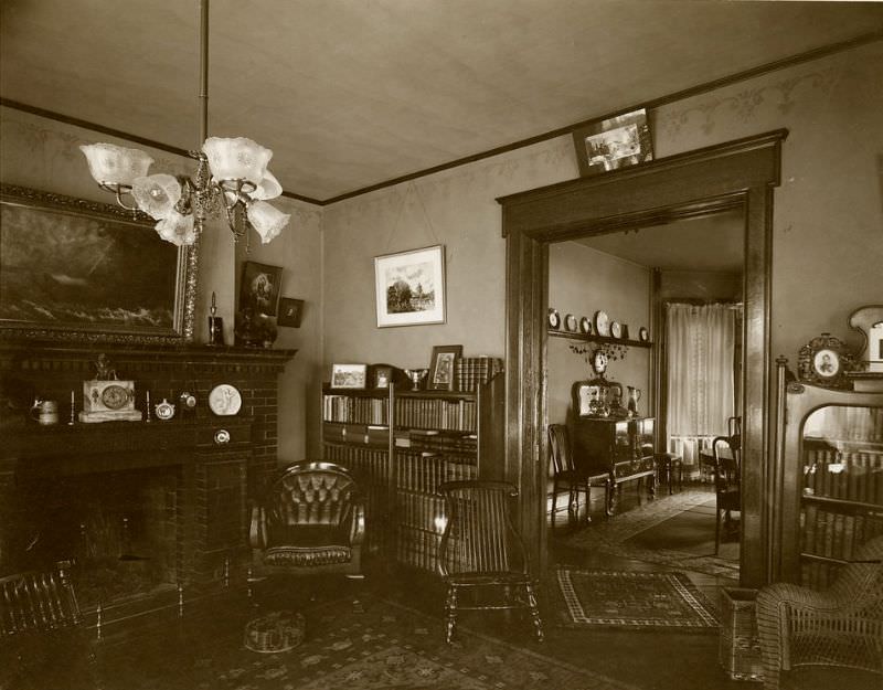 Shambaugh house. A view of the library, with a view of the dining room beyond, 1904