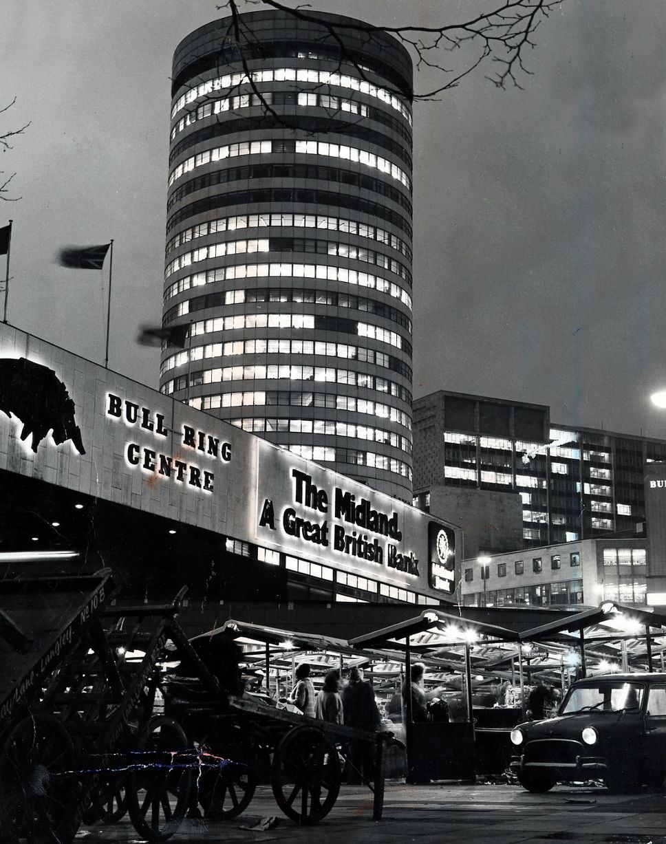 The Bull Ring market at night overlooked by the Rotunda 1986.