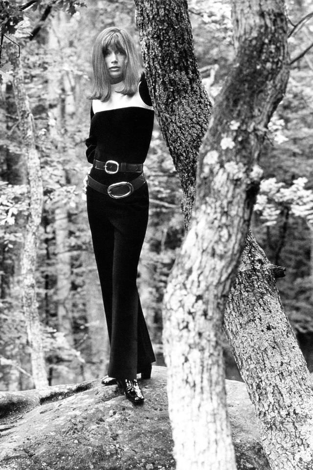 Olga Georges-Picot wearing a sleeveless black wool knit jumpsuit with a white yoke, over a long-sleeve black shirt, 1969