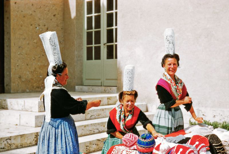 Lacemakers in traditional dresses outside Chartres Cathedral, Chartres, 1958