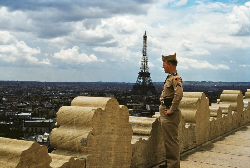 View towards the Eiffel Tower from the Arc de Triomphe (the soldier is Canadian), 1953