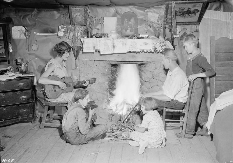 The Glandon family around the fireplace in their home at Bridges Chapel near Loydston, Tennessee.