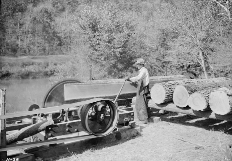 Curtis Stiner operating a circular saw at the Norris Dam site, Tennessee, October 1933