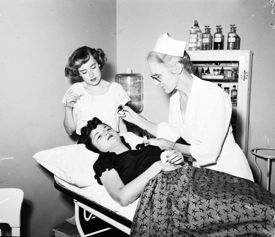 Nancy Matthews at hospital for treatment. Her eyes were affected from smog, 1950