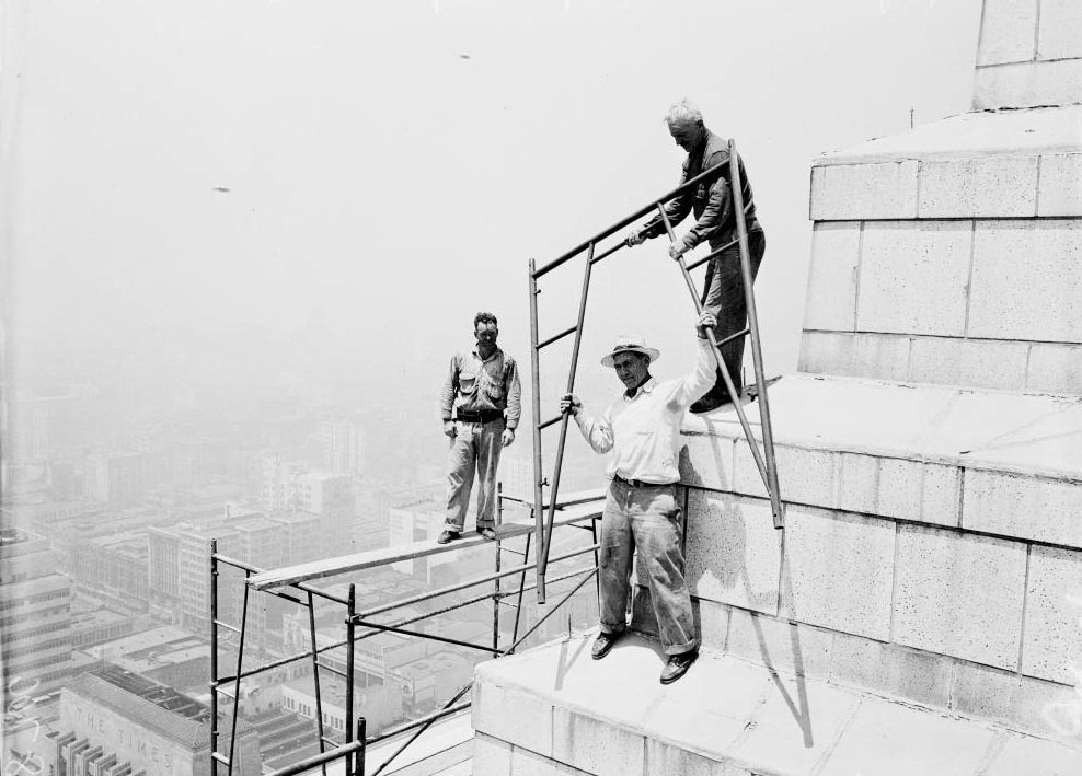 Three men on top of the building to observe the Smog, 1950.