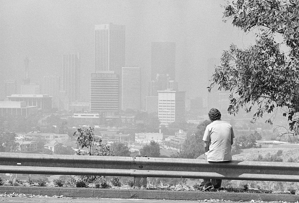 Man Seated, Looking at Smoggy Los Angeles