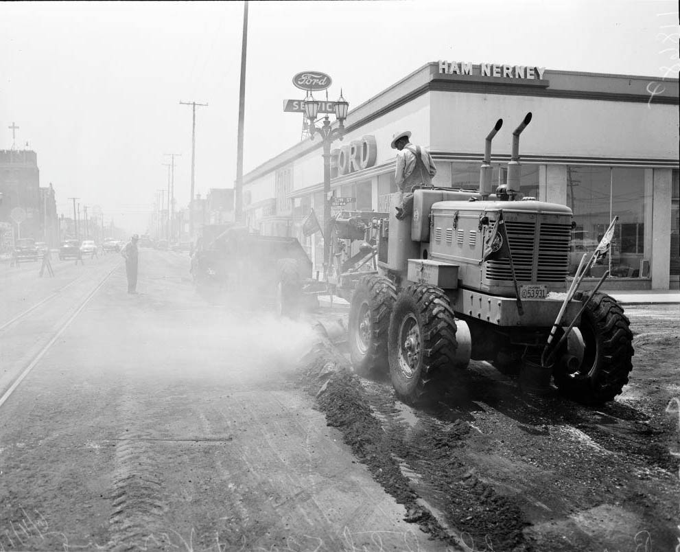 Burning off black top at 52nd Street and Vermont Avenue, 1956