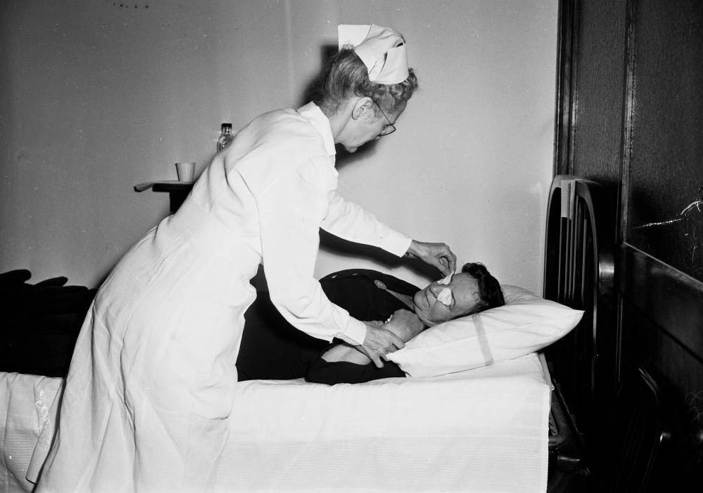 Nurse Ruth Bergman taking care of Mrs. John Wickham, 1949