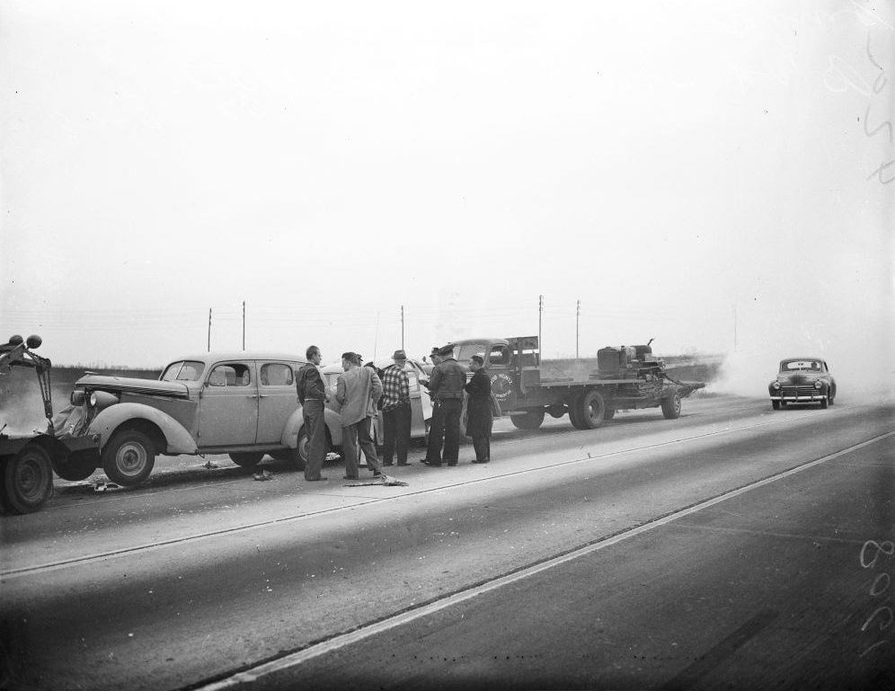 General views of autos and trucks piled up in freak accident on east side of Lincoln Boulevard, south of Manchester Avenue, 1948