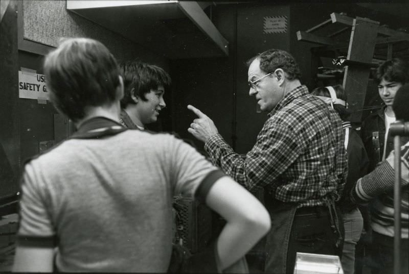 Teacher scolding a student in carpenter class