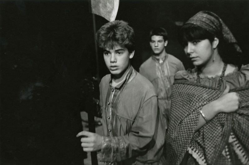 Three students in theater costumes