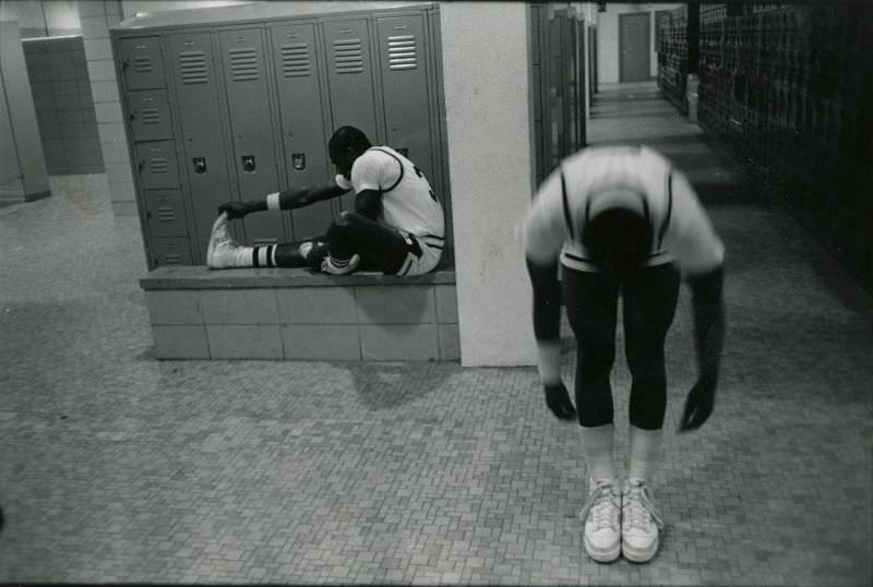 Two basketball players in the locker room