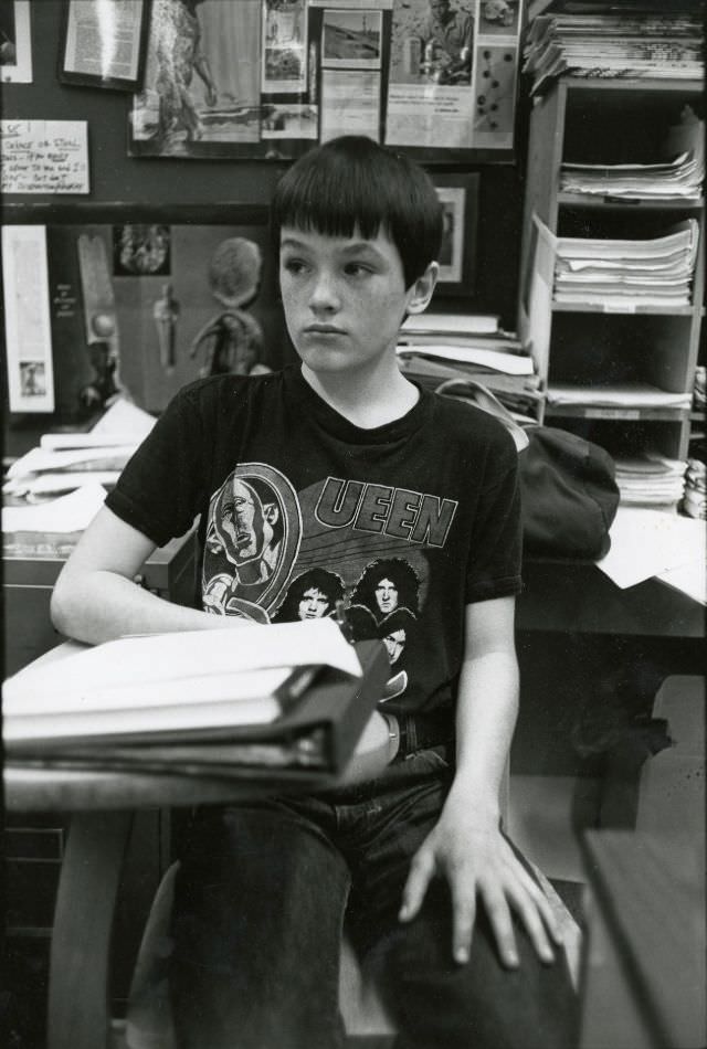 Boy in Queen t-shirt in classroom