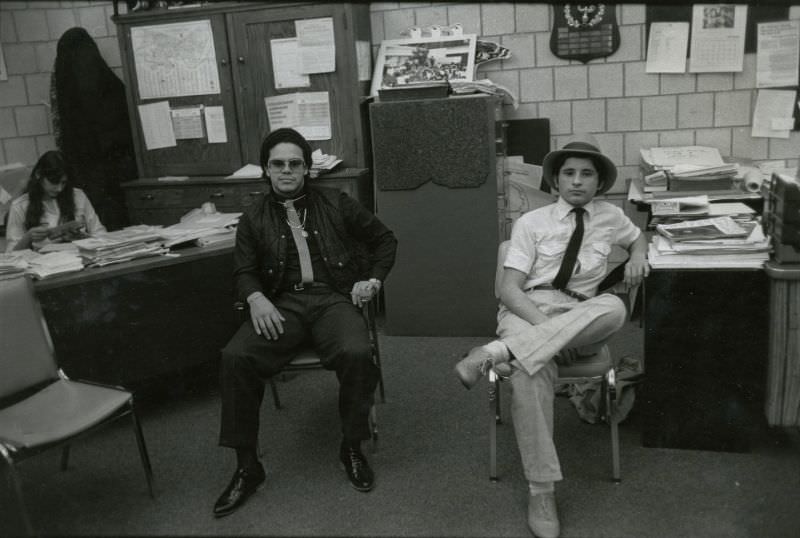 Two students sitting in a school office