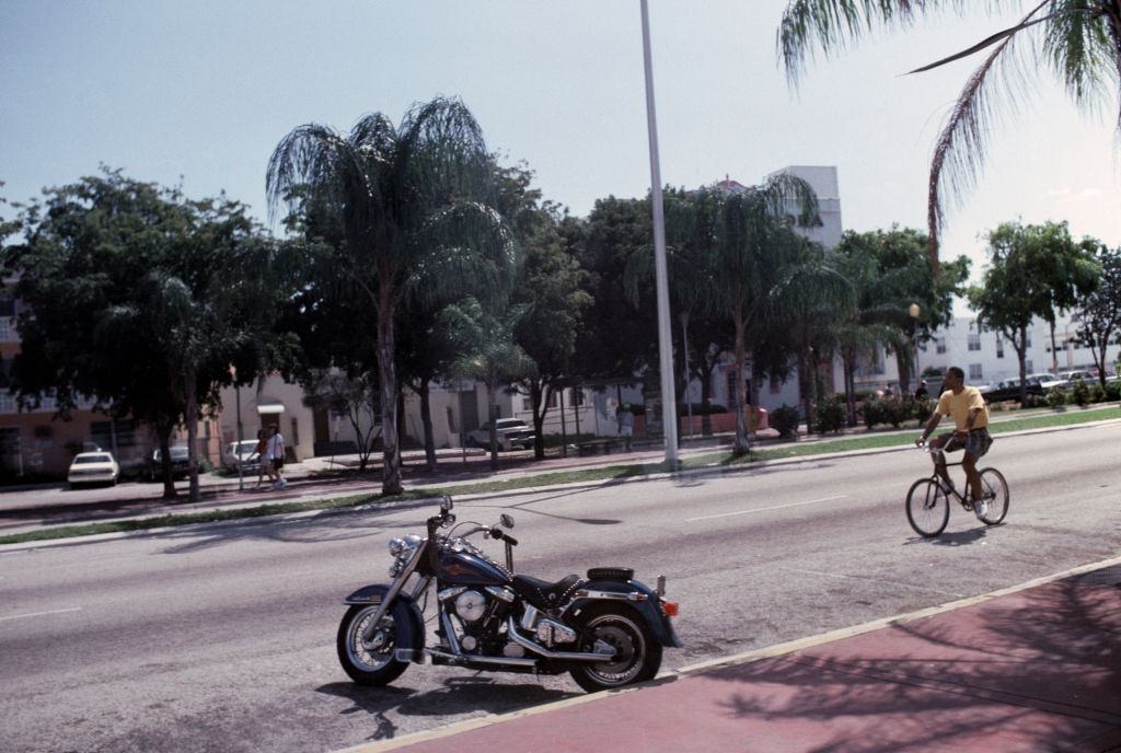 Motorcycle and bicycle in Miami beach, 1992.