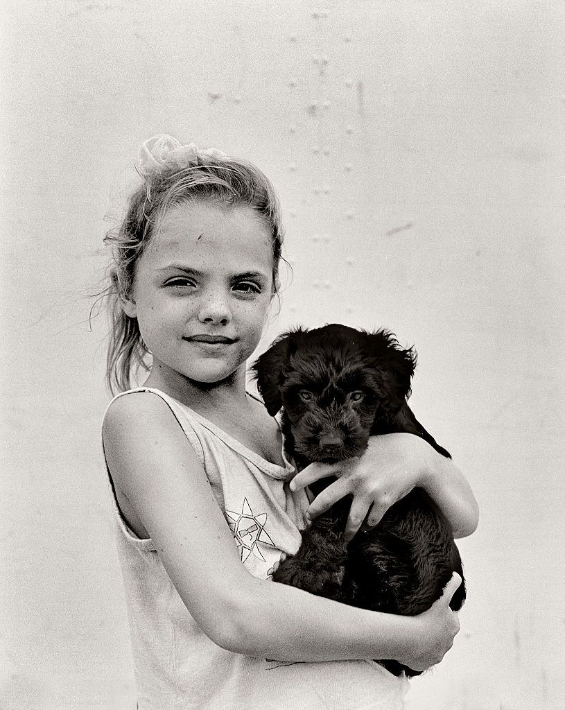 Girl with pet dog, Miami beach, Florida.