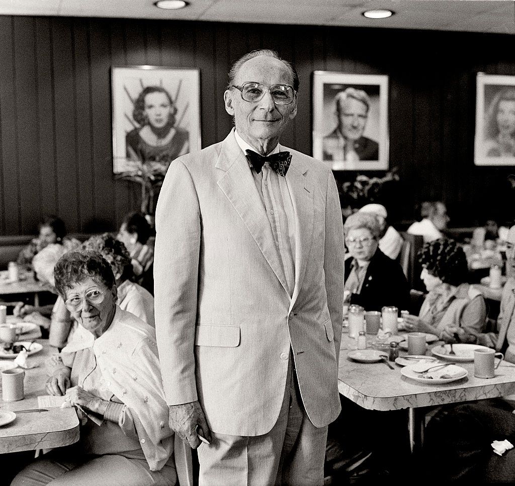 Judge Seymour Gelber, Mayor of Miami Beach standing in Wolfies diner.