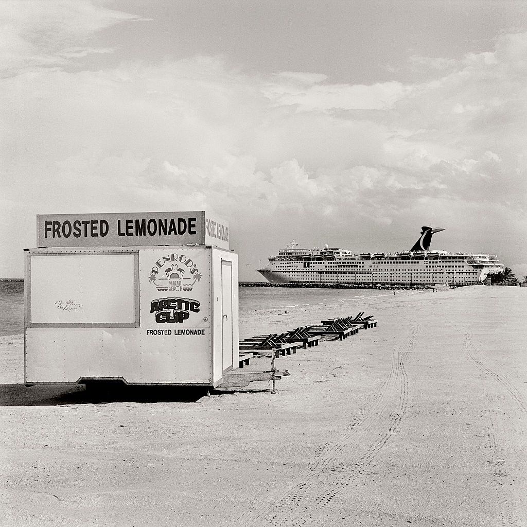 Miami beach vendor with a cruise ship leaving the Port of Miami.