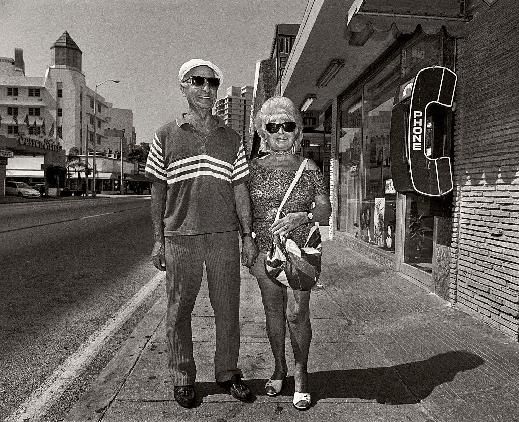Retired couple outside Wolfies, Miami Beach, Florida.