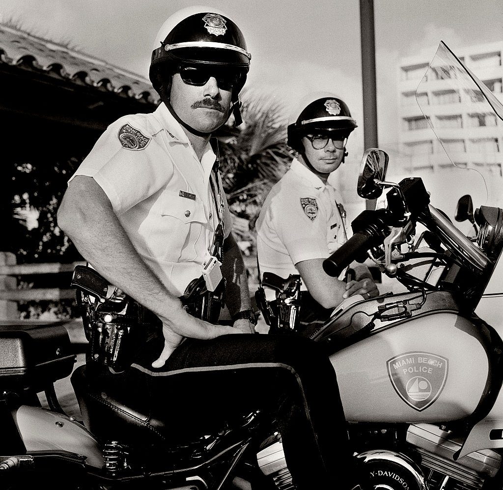 Motorcycle policemen on Collins Avenue, Miami Beach, Florida.