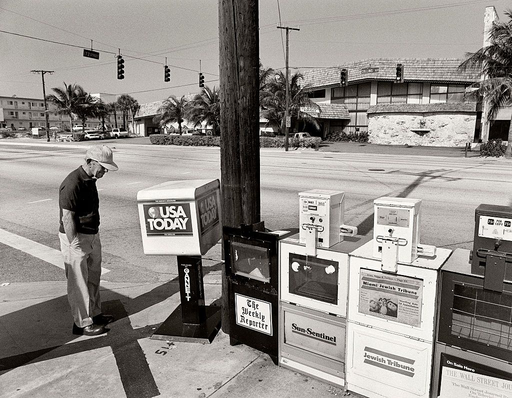 Paper vending machines, Collins Avenue, Miami Beach, Florida.