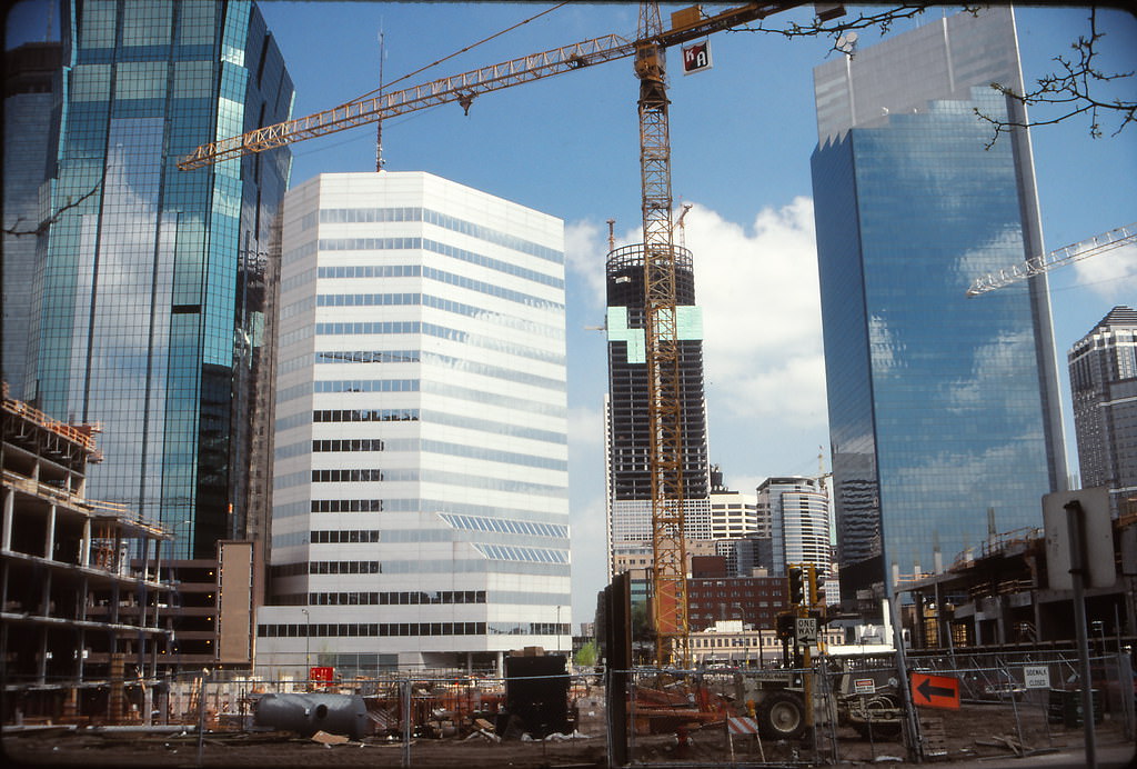 Construction in downtown Minneapolis: Hilton Hotel at left and foreground, Leamington Garage at right, FirstBank Place/IBM (now Capella Center/225 S 6th) in center background, May 1991