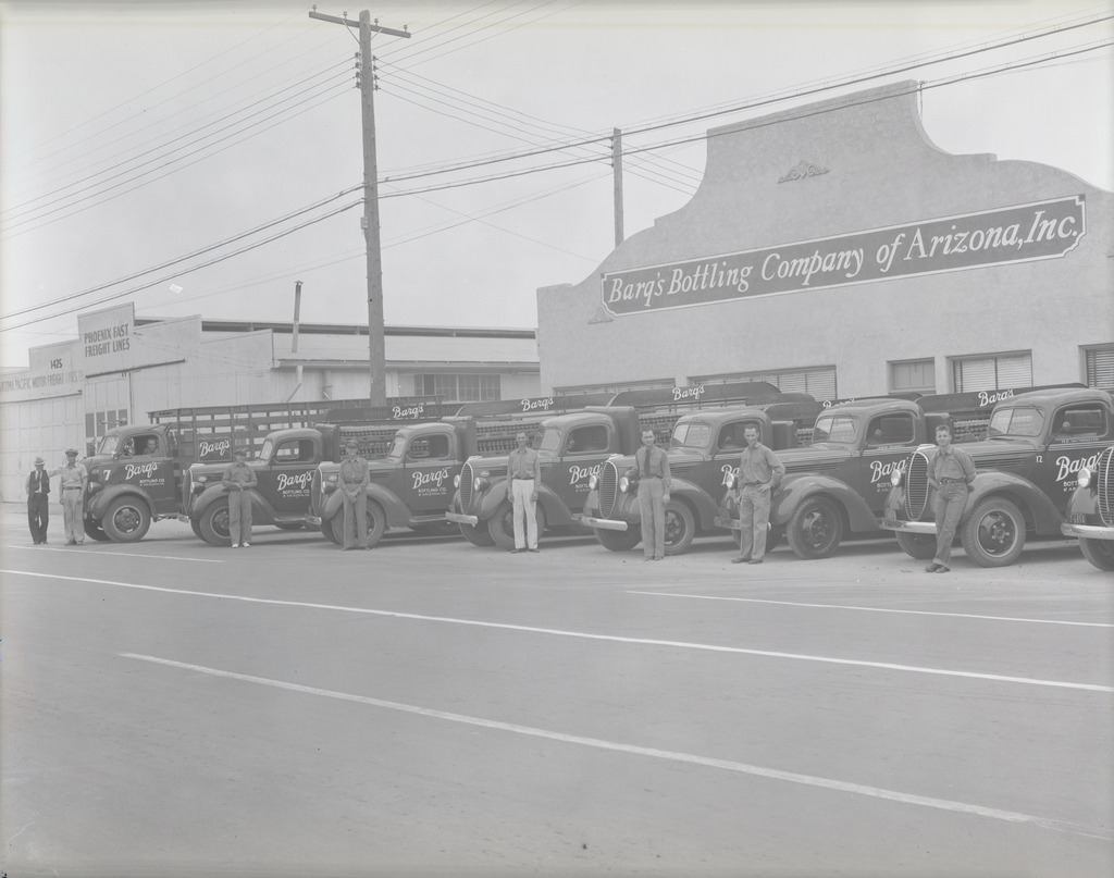 Building and Men Standing in front of Barq Delivery Trucks, 1940