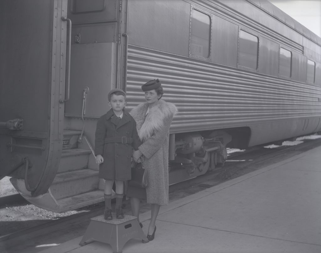 Woman and Young Boy Standing next to a Santa Fe Train, Phoenix, 1940